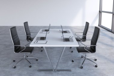 Modern meeting room with huge windows with copy space. Black leather chairs and a white table with laptops. 3D rendering.