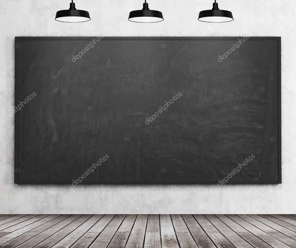 A stylish room with black chalkboard on the wall, wooden floor, and three ceiling lights.Class room. 3D rendering.