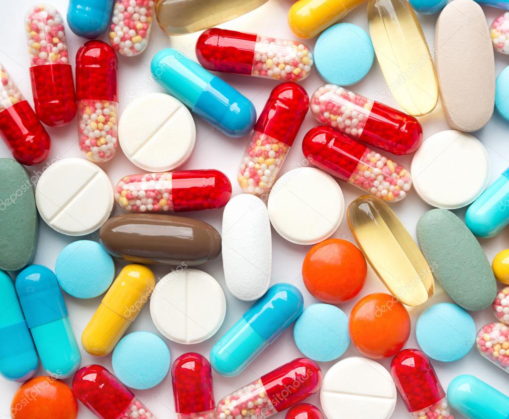 Heap of medicine pills. Background made from colorful pills and capsules