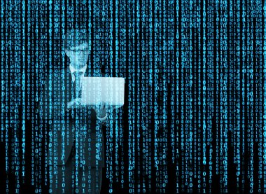 Digital hologram in a matrix style. A person with laptop is browsing data in the Internet. Blue.