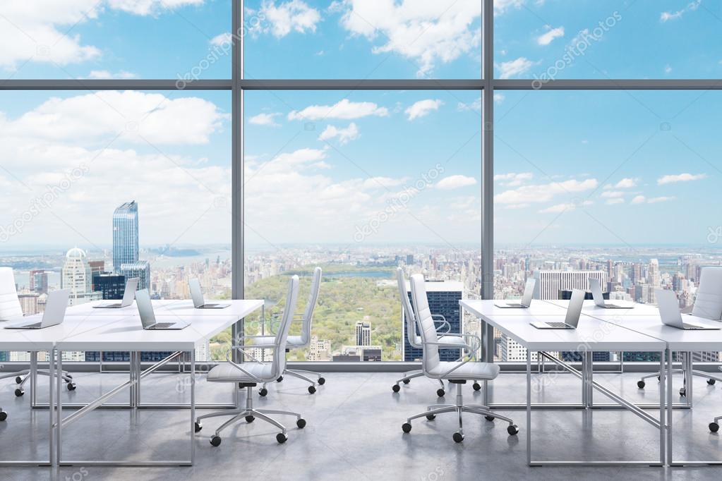 Workplaces in a modern panoramic office, New York city view from the windows. A concept of financial consulting services. 3D rendering.
