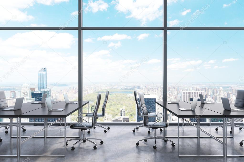 Workplaces in a modern panoramic office, New York city view from the windows. Black tables and black leather chairs. A concept of financial consulting services. 3D rendering.