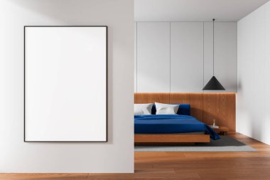 Spacious bedroom interior with blank wall poster mockup on left, wood and blue bed design on right, white background wall, concept of design template. 3D Rendering