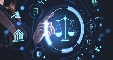 Businesswoman touching glowing justice scale hologram with legal icons around, futuristic digital style on dark background, concept of legal tech innovation