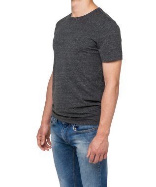 Side view of a man in a dark grey t-shirt and denims. Isolated on white.