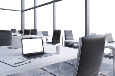 Workplaces in a modern corner panoramic office, copy space in the windows. Open space. White tables and black chairs. A laptop with a white screen, notepad and a coffee cup. 3D rendering.