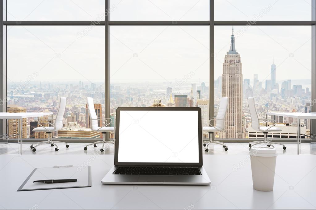 Front view of the workplace in a modern panoramic office in New York. White tables and white chairs. A laptop with a white display, notepad and a coffee cup are on the table. 3D rendering.