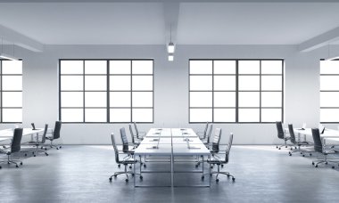 A conference room or corporate workplaces equipped by modern laptops in a modern panoramic office with white windows. Black leather chairs and a white table. 3D rendering.