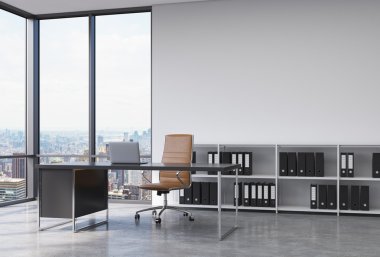 A CEO workplace in a modern corner panoramic office with New York city view. A black desk with a laptop, brown leather chair and a bookshelf with black document folders. 3D rendering.