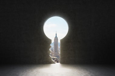A keyhole in the concrete wall. New York City view in the hole.
