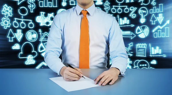 A person is going to write down something on the white paper. Hologram blue business icons are on the background. — Stock Photo, Image