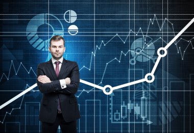 Front view of the handsome manager with crossed hands. Financial analytic charts are drawn on the background.
