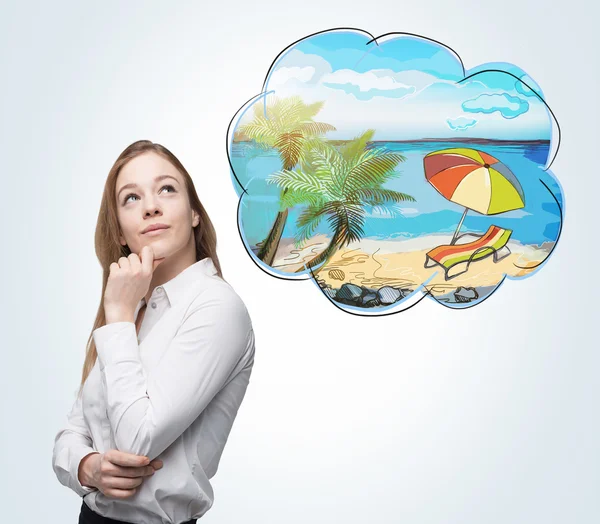 A side view of a woman who dreams about summer vacation on the beach. A nice summer place is drawn in the thought bubble. Concrete wall. — Stock Photo, Image