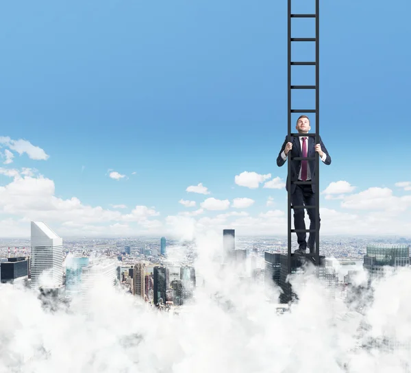 A businessman is climbing up the ladder. Clouds and New York view. The concept of the success. — Stock Fotó