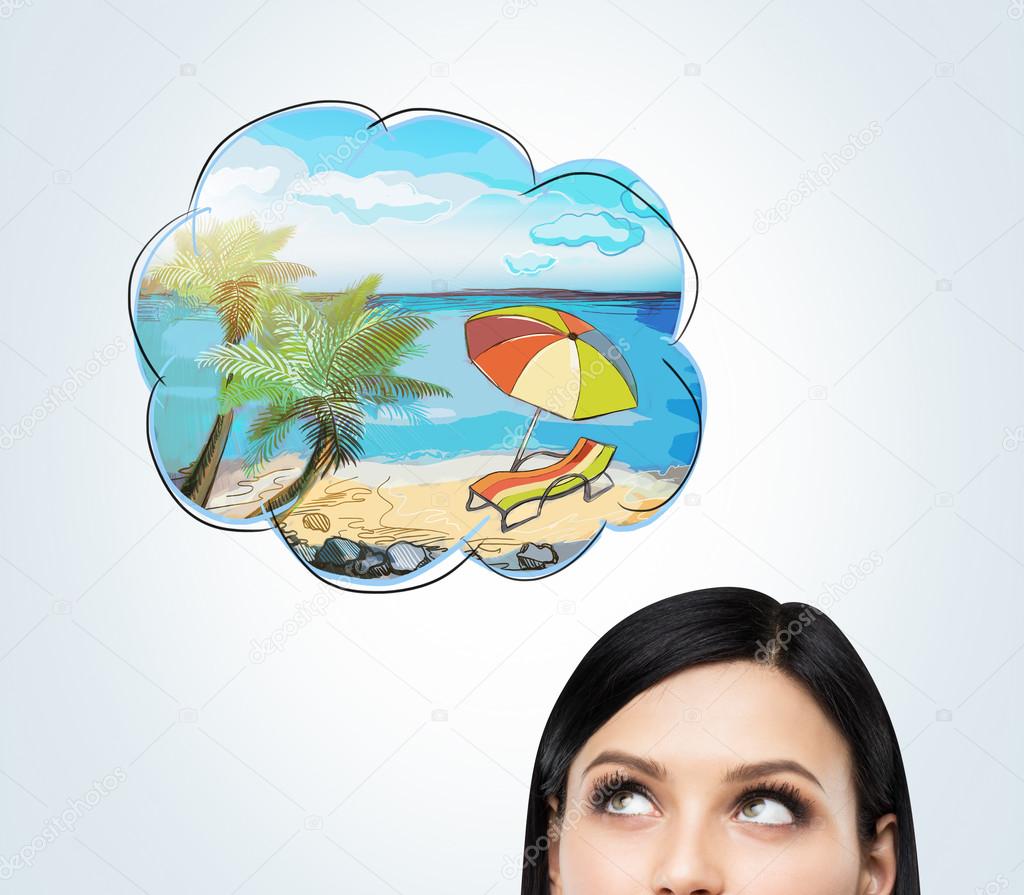 A forehead of a brunette woman who dreams about summer vacation on the beach. A nice summer place is drawn in the thought bubble. Concrete wall.