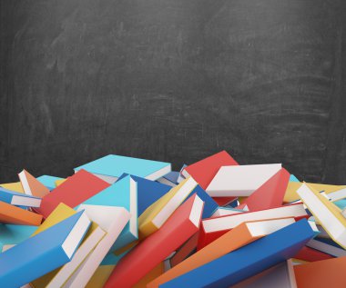 A heap of different books with colorful covers which are laying on the floor. Black chalk board on the background.