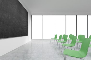 A classroom or presentation room in a modern university or fancy office. Green chairs, panoramic windows with white copy space and a black chalkboard on the wall. 3D rendering.