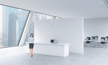 A full length of a beautiful receptionist in a bright modern roof loft office with panoramic Singapore view. The concept of luxury consulting services.