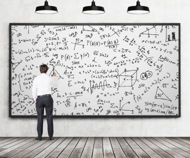 Rear view of young professional who is writing down math formulas on the whiteboard. A concept of analytical calculations. Wooden floor, concrete wall and three black ceiling lights are in the room. clipart