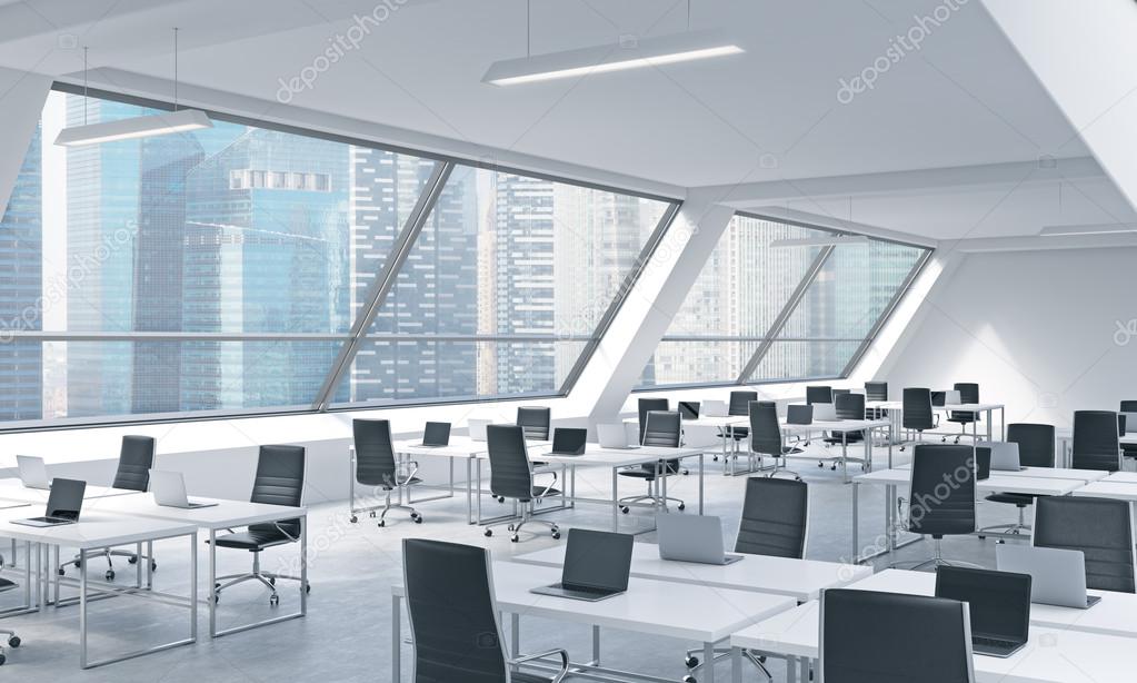 Workplaces in a bright modern open space loft office. White tables equipped by modern laptops and black chairs. Singapoere panoramic view in the windows. 3D rendering.