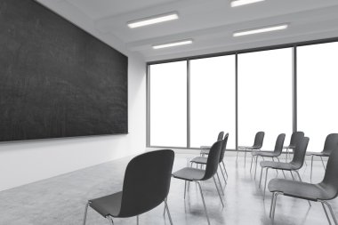 A classroom or presentation room in a modern university or fancy office. Black chairs, a black chalkboard on the wall and panoramic windows with white copy space. 3D rendering.