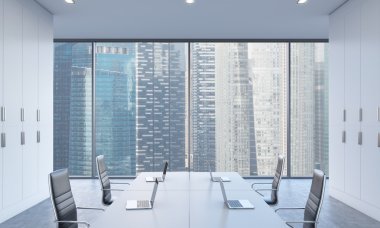 Workplaces or conference area in a bright modern open space office. White tables equipped by modern laptops and black chairs. Singapore view. 3D rendering.