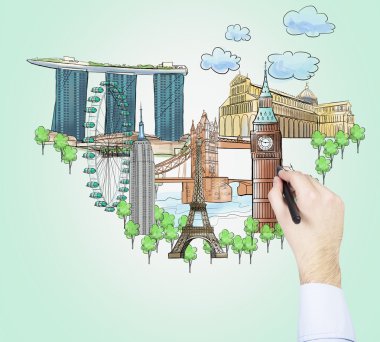 A hand is drawing a sketches of the most famous touristic places on the light green background. The concept of tourism and sightseeing.