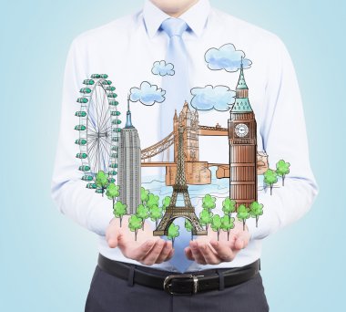 A person in formal clothes holds in his hands a sketch of famous places from all over the world. Light blue background.