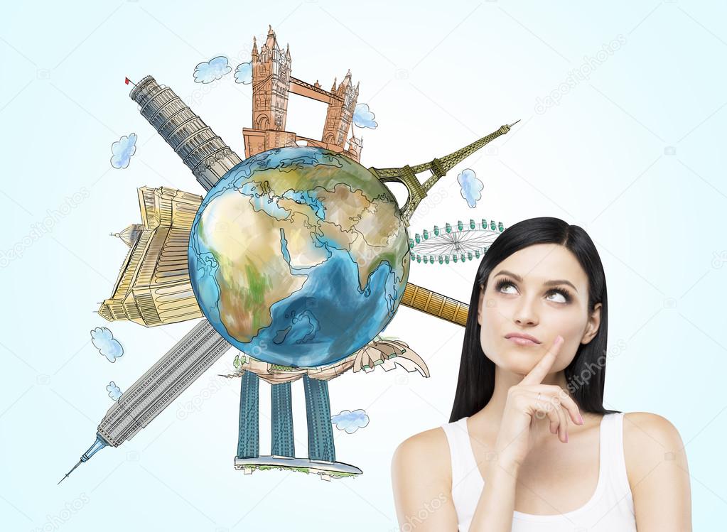 A brunette woman thinks about travelling. A globe with sketched famous places. Light blue background. Elements of this image furnished by NASA.