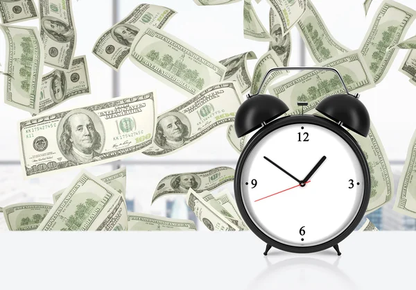 An alarm clock is on the table. Falling dollar notes on background. The concept of 'time is money' and a time management. — Stockfoto