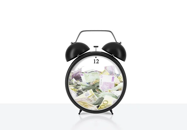 There is EURO bills inside the alarm clock which is on the table. The concept of 'time is money' and a time management. White background. — Stockfoto