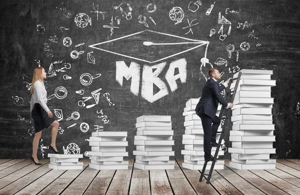 A woman is going up using a stairs which are made of white books to reach graduation hat, while a man has found a shortcut to get MBA degree. A black chalkboard with the written word MBA. — Stock Photo, Image