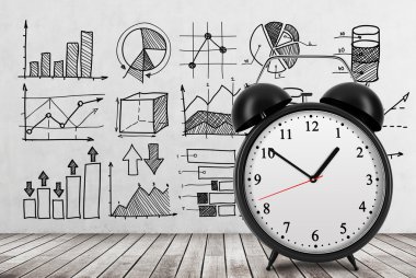 There are different business charts on the concrete wall. An alarm clock is settled on the front view of the photograph. 3D rendering. Wooden floor.