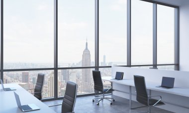 Workplaces in a bright modern open space office. White tables equipped with modern laptops and black chairs. New York panoramic view in the windows. 3D rendering. clipart