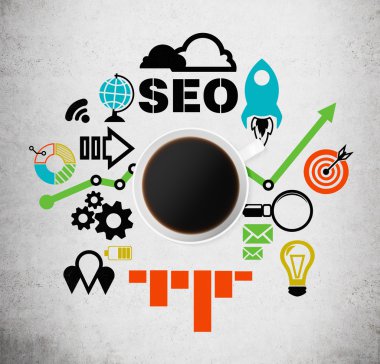 Top view of a coffee cup with the word 'SEO' and colourful charts, business icons and graphs. Concrete background.