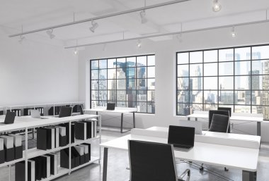 Workplaces in a bright modern loft open space office. Tables equipped with laptops; corporate documents' shelves. New York in the panoramic windows. 3D rendering.