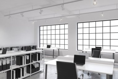 Workplaces in a bright modern loft open space office. Tables equipped with laptops; corporate documents' shelves. White copy space in the panoramic windows. 3D rendering.