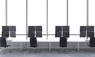 A modern trader's workplaces in a bright modern open space office. White tables equipped with modern trader's stations and black chairs. White copy space in the panoramic windows. 3D rendering.