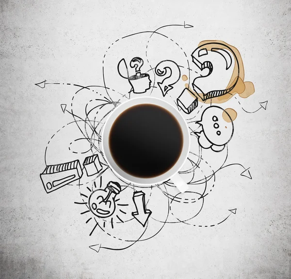 Top view of a cup of coffee and black business icons with question mark on the concrete background. The concept of brainstorm process.