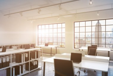Workplaces in a bright modern loft open space office. Tables equipped with laptops; corporate documents' shelves. New York in the panoramic windows. 3D rendering. Toned image.