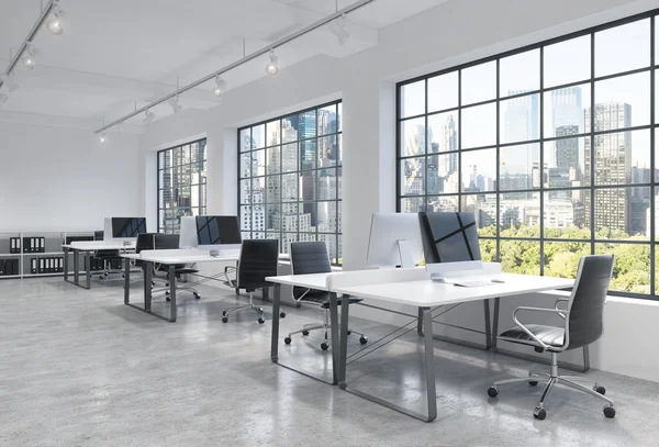 Workplaces in a bright modern loft open space office. Tables are equipped with modern computers; book shelves. New York panoramic view. A concept of a high quality consulting services. 3D rendering. — Stock Photo, Image