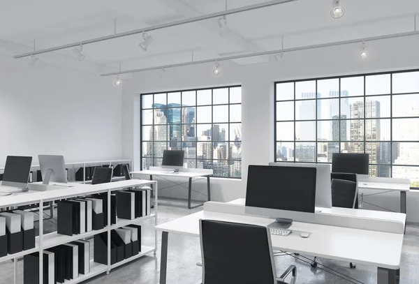 Workplaces in a bright modern loft open space office. Tables are equipped with modern computers; book shelves. New York panoramic view. A concept of a high quality consulting services. 3D rendering.