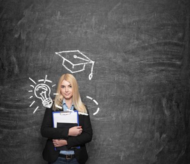 young girl holding note books, drawn academic hat above her