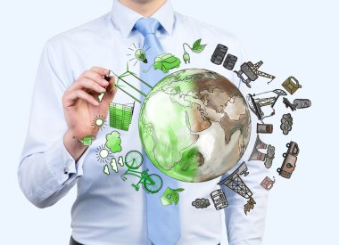 man pointing at oil production and eco energy icons, environment