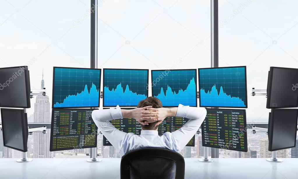 man in office with computers processing data, trading,  new york