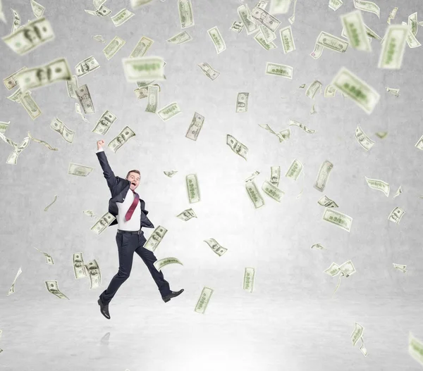 Businessman jumping, money rain — Stockfoto