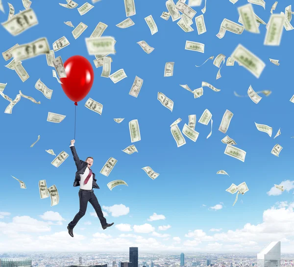 Businessman jumping, money rain — Stockfoto