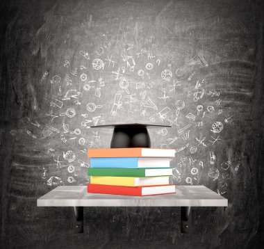 Pile of books and academic hat