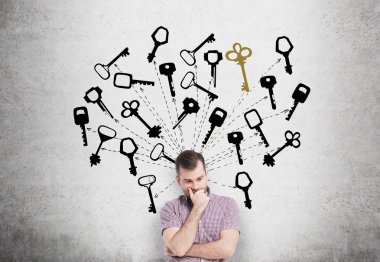 Young man with hand to the chin looking up in search of the right solution which are presented as keys around him.