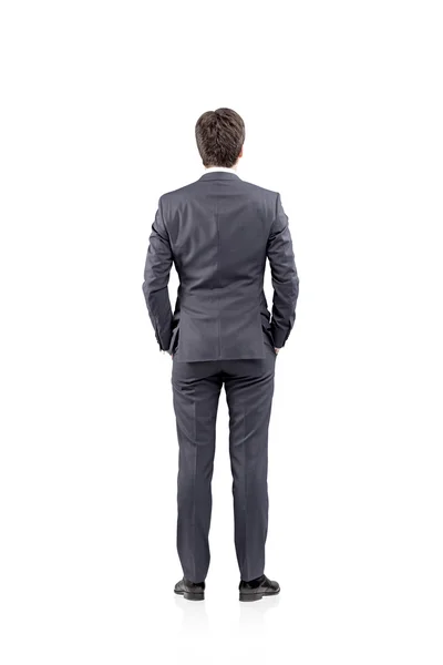 Young businessman standing with his hands in pockets. Back view. Concept of thinking — 스톡 사진